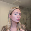 Video featuring a voluminous blowout created with SURETHIK XL Volume Boost Blow-Dry Spray.